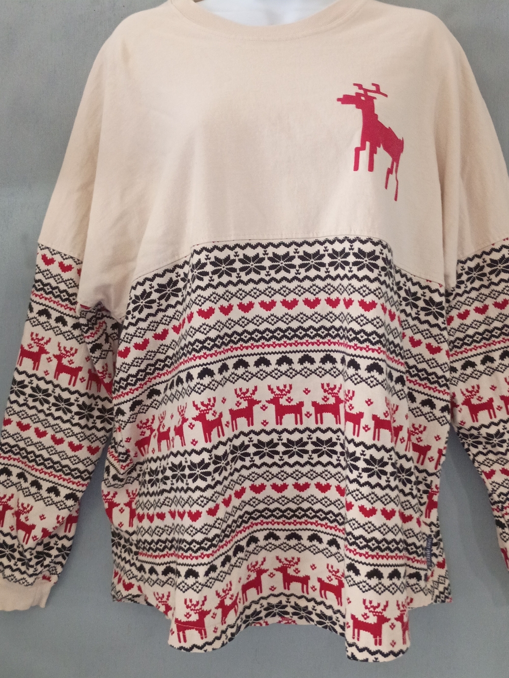 Spirit Cream Crewneck Sweater with Red and Black Reindeer Motif